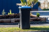 Rubbish bin on a footpath